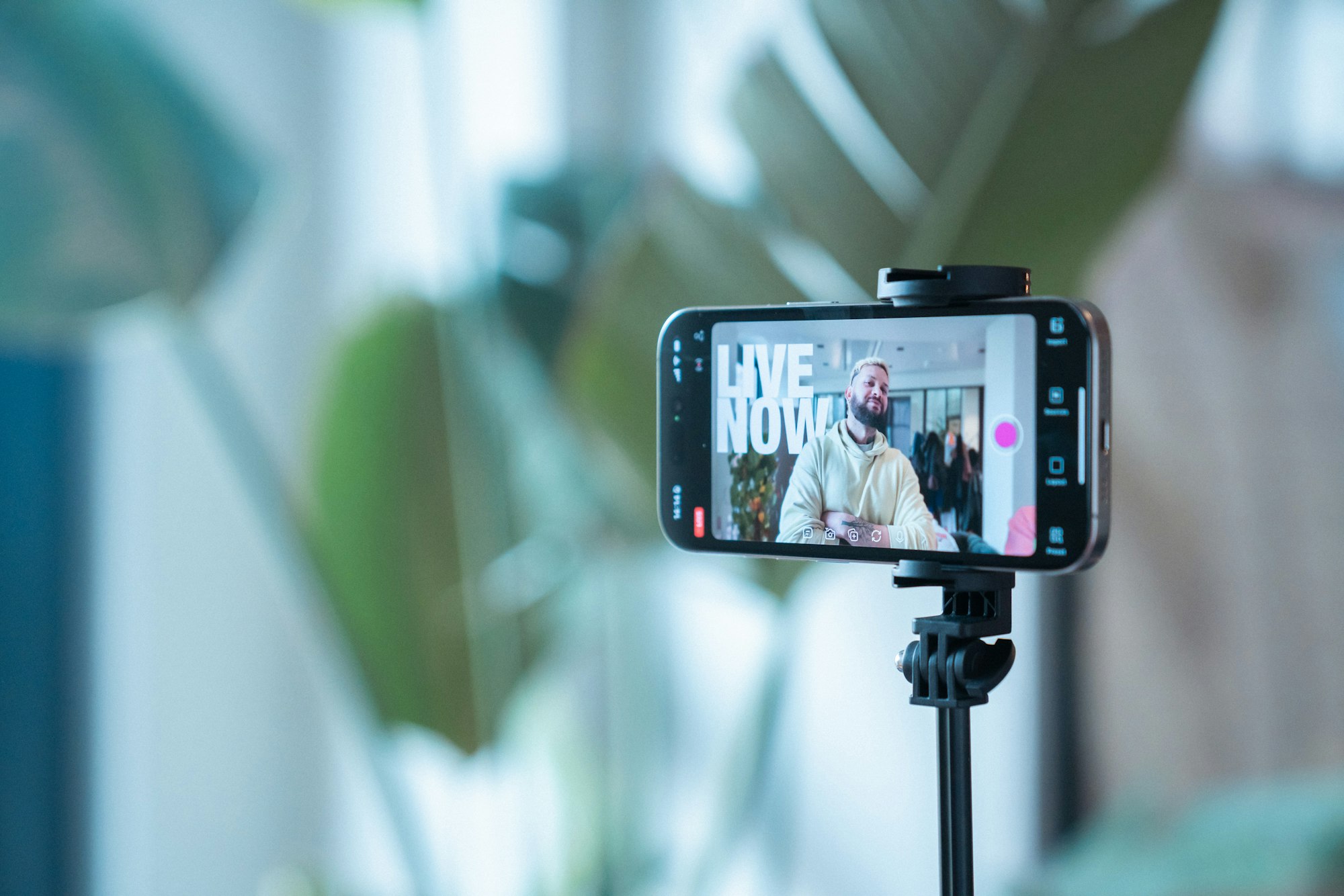 A phone on a tripod recording a creator